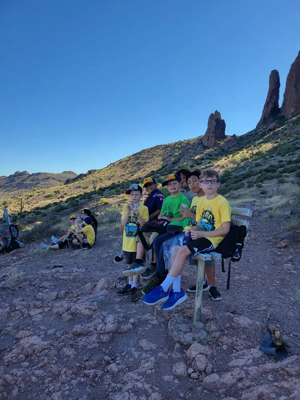 Pack 88 scouts taking a break together on a desert trail